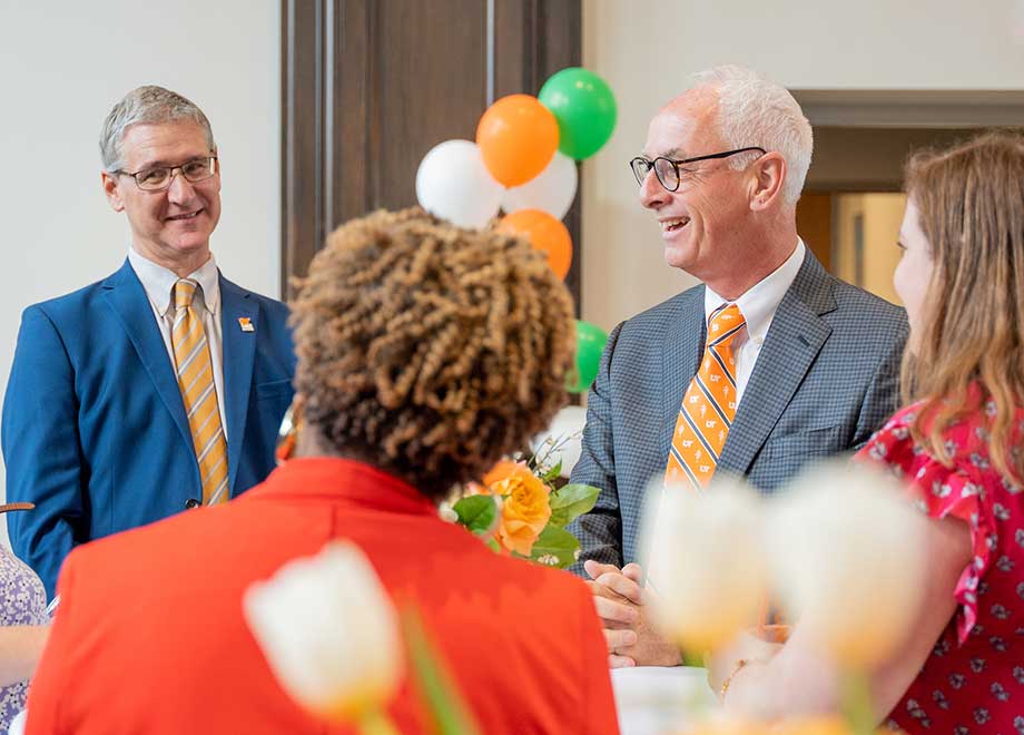 The chancellor with faculty and staff at a giving celebration.