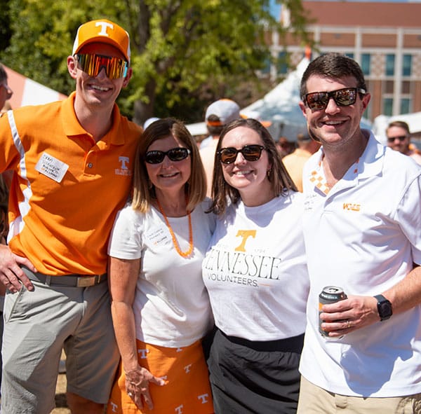 A group of four alumni pose for a photo during a UT Health Science Center event.
