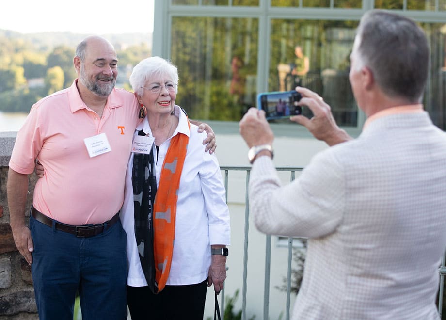 alumni-photo-on-river-920x660 A couple poses for a photo with the Tennessee River in the background.