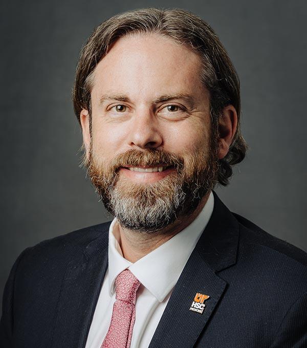 Headshot of Cameron Mann.