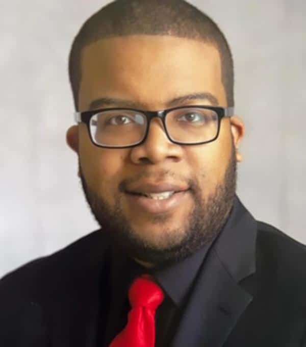 Headshot of William Thomas.